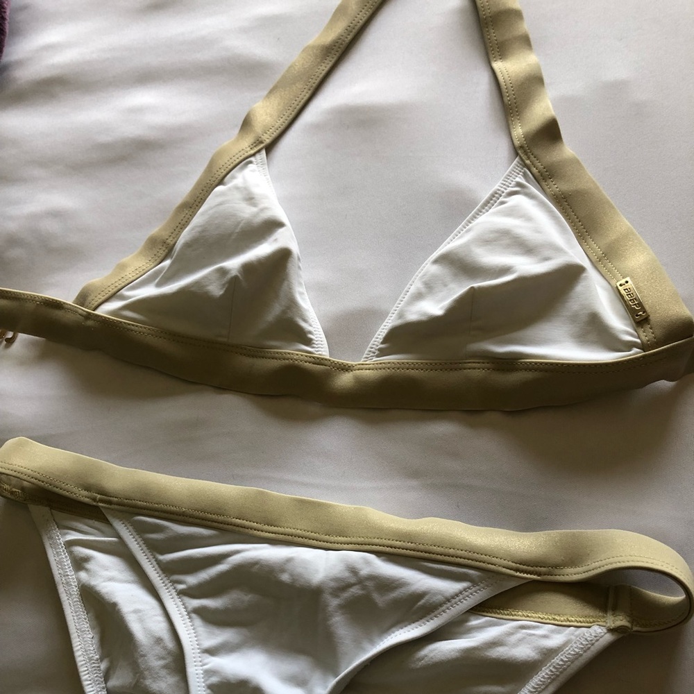 4 Bikinis size small, slightly used.